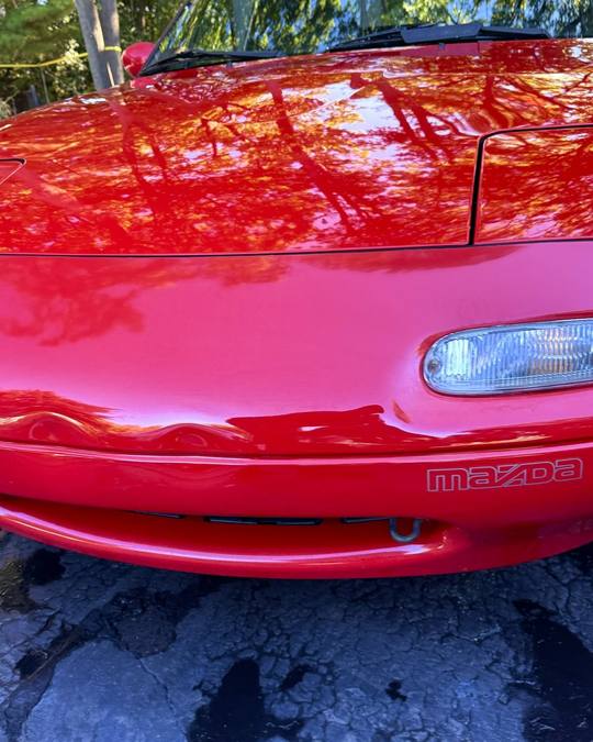 The same Miata after a two step paint correction and ceramic coating