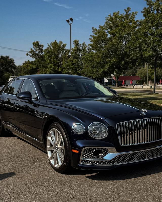 Dark Bentley sedan with a mirror finish