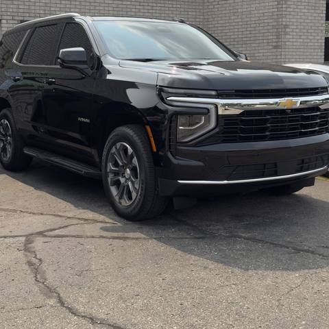 Black Chevrolet SUV outside the shop