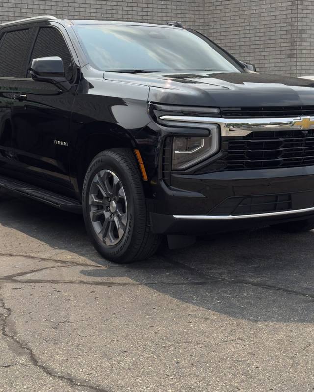 Black Chevrolet SUV outside the shop