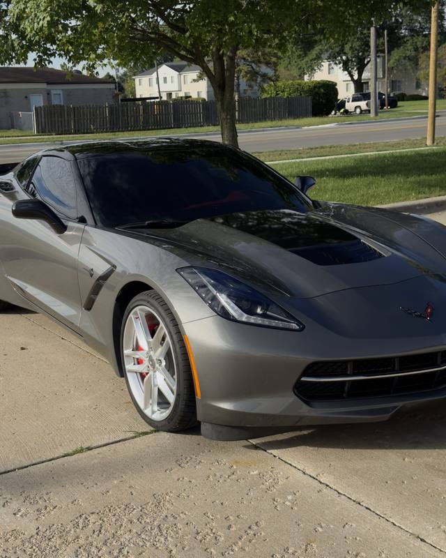Gray Corvette parked outside
