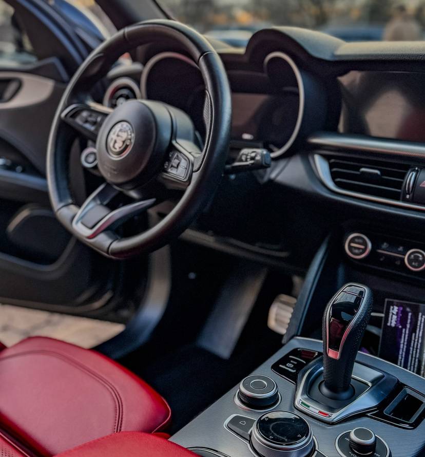Detailed Alfa Romeo interior with red leather seats