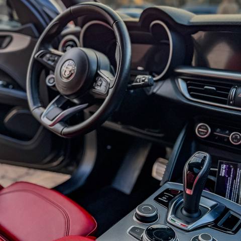 Detailed Alfa Romeo interior with red leather seats