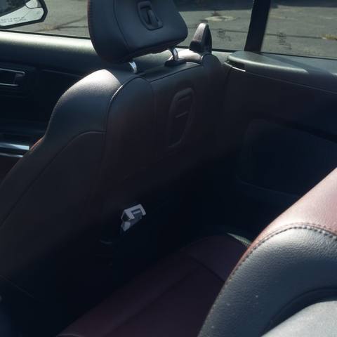 Detailed convertible interior with black and red leather