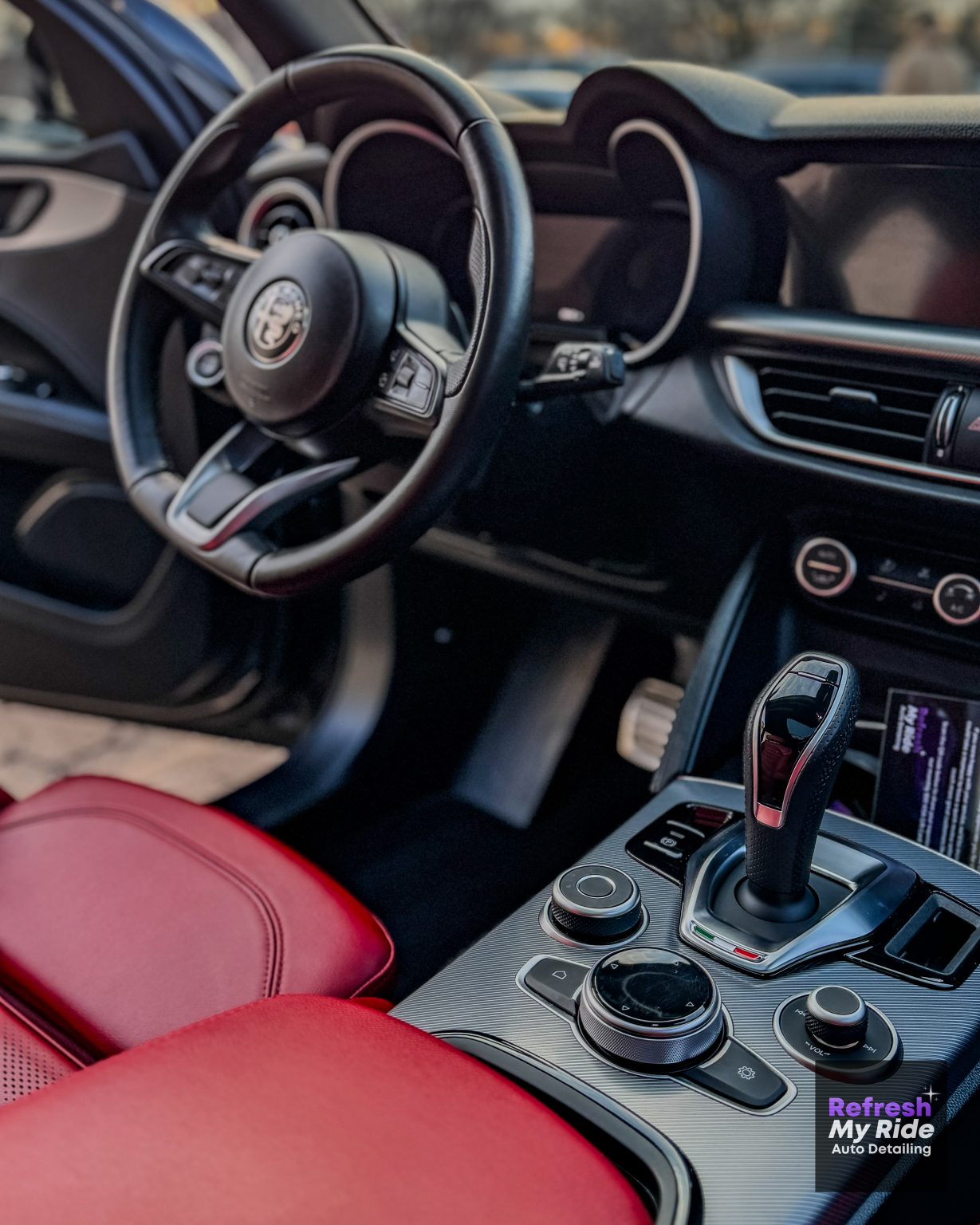 Detailed car interior with clean leather seats, dash and console