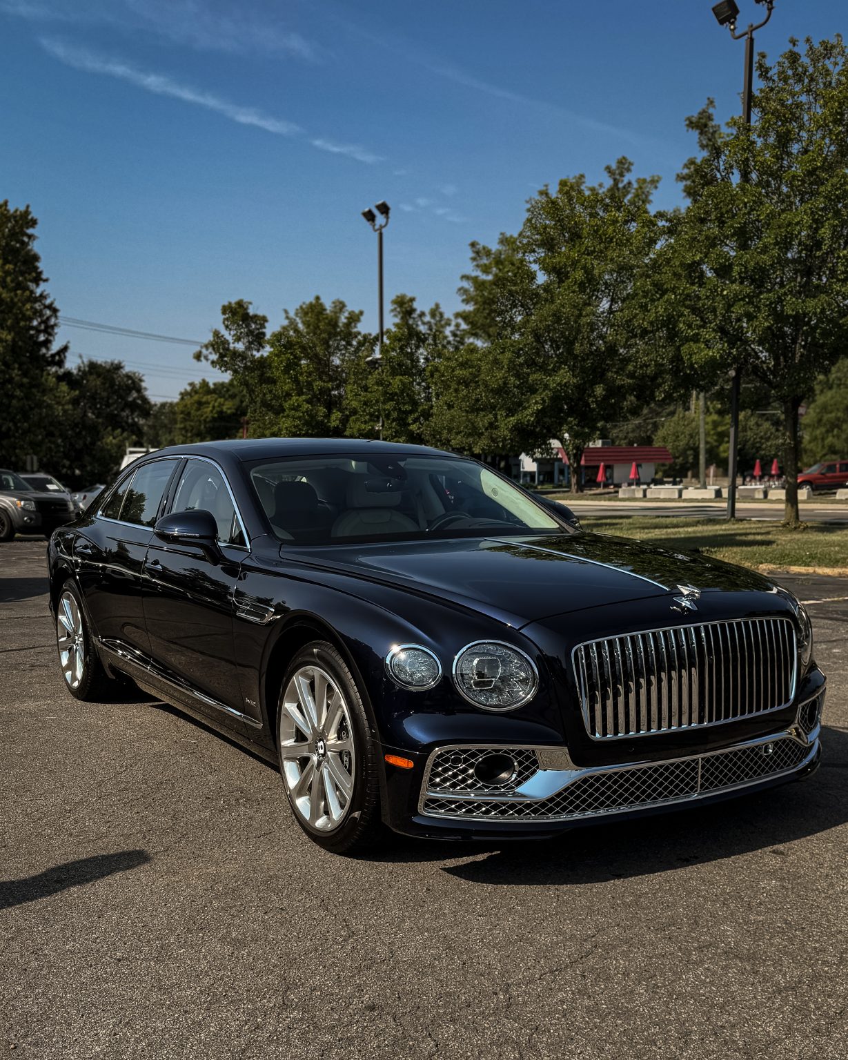 Black Bentley sedan with freshly washed and sealed paint
